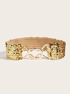 Detail of a sparkling gold sequin elastic waist belt featuring a polished metal interlocking buckle