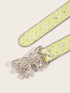 Détail de boucle papillon Y2K et ceinture tissée vert clair avec paillettes argentées