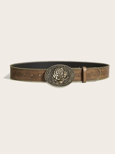Detail of vintage brown leather belt featuring floral embossing and a 3D rose metal buckle