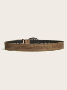 Close-up of vintage brown leather belt with floral embossing and gold bead trim