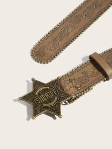 Close-up of brown leather belt with floral embossing, metal beads and sheriff star buckle