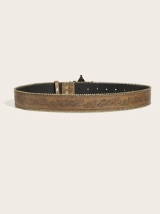 Detail of brown leather belt with embossed floral pattern and gold beaded edges