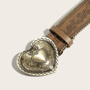 Brown vintage belt with large golden heart buckle featuring floral carvings and embossed leaf