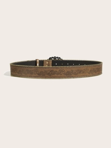 Detailed view of bohemian style belt featuring floral embossing and metal bead trim edges