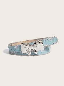 Close-up of light blue denim belt with silver metal butterfly buckle and bead trim