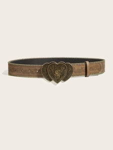 Detail of bohemian brown leather belt with vintage floral carving and double heart buckle
