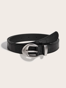 Close-up of black crocodile embossed leather belt with a matte silver oval buckle