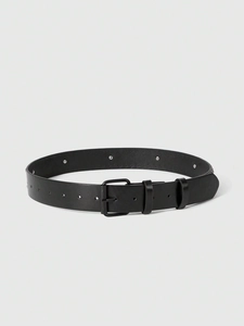 Close-up of black punk belt with silver metal eyelets and matte square buckle