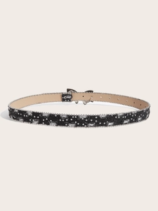 Close-up of black canvas belt with silver sequins and metallic pin buckle detail