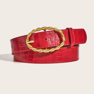 Red crocodile embossed leather belt for women with a twisted gold oval buckle