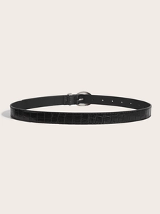 Close-up of the black crocodile embossed leather texture and silver oval metal buckle