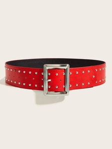 Detail of red punk leather belt featuring double rows of silver studs and a big buckle
