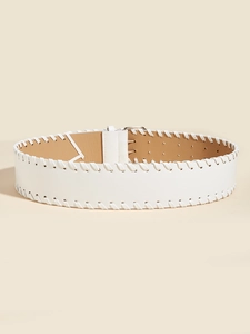 Detail of white PU leather belt with woven braided edges and a silver metal buckle