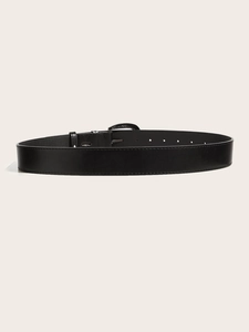 Close-up of black punk leather belt with reinforced stitching and metal pin buckle