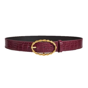 Elegant burgundy leather belt with crocodile pattern and golden twisted oval buckle