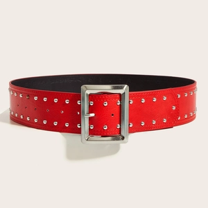 Punk style wide red leather belt with double rows of silver studs and large metal buckle