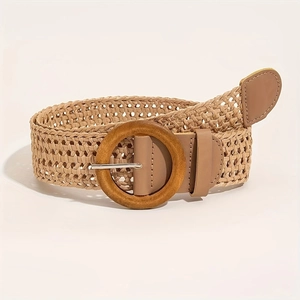 Detail of light khaki woven belt with round wooden buckle and bohemian hollow patterns