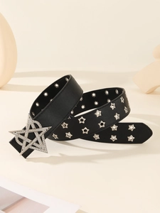 Close-up of black leather punk belt featuring large rhinestone star buckle and star eyelets