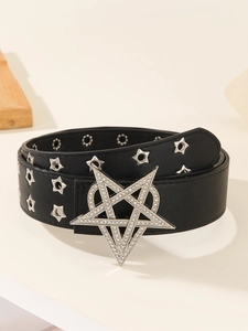 Close-up of black punk belt with large silver star buckle and sparkling rhinestones