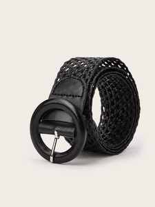 Detail of black woven belt with openwork texture and a round polished metal buckle