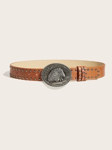 Detail of vintage brown leather belt with studs and eagle embossed metal buckle