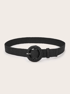 Detail of black woven belt with a round buckle and silver metal pin for casual style