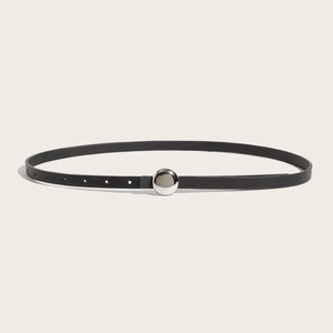 Minimalist black leather belt for women with a round silver buckle for jeans