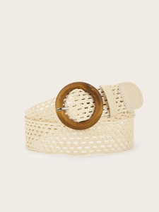 Close-up of woven straw belt texture with a vintage round wooden buckle and leather tip