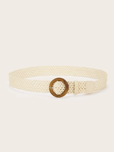 Close-up of bohemian beige woven belt featuring a round dark wooden buckle detail