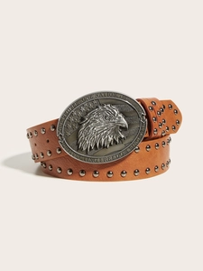 Close-up of vintage brown leather belt with metal studs and eagle buckle relief
