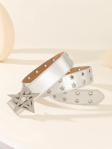 Close-up of silver punk belt with star-shaped diamond buckle and metallic eyelets