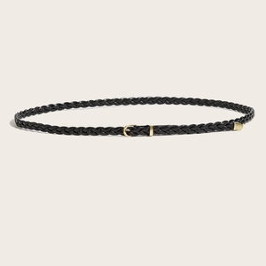 Retro black woven leather belt for women with elegant gold pin buckle on beige background