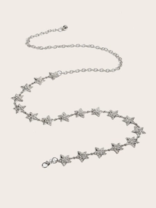 Close-up of a silver star waist chain with sparkling rhinestones and adjustable links