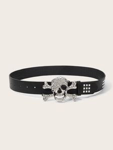 Detail of silver skull buckle with sparkling rhinestones and metal studs on black punk belt