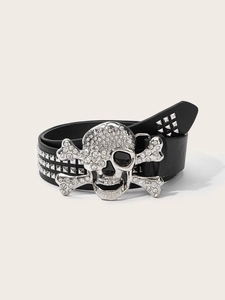 Detail of punk black leather belt with crystal skull buckle and triple rows of square studs