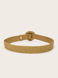 Macro shot of handcrafted woven belt texture with a round buckle for dresses