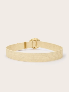 Close-up detail of beige woven elastic belt featuring a decorative round beaded buckle