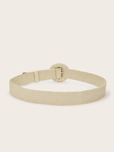 Close-up detail of beige woven waist belt featuring a round fabric-covered buckle