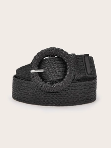 Detailed close-up of a black woven belt featuring a round buckle and silver metal pin