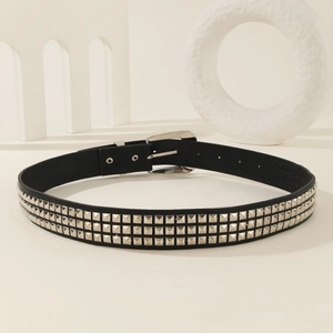 Punk style black leather belt featuring three rows of silver pyramid studs and polished buckle