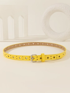 Detail of yellow skinny belt featuring star-shaped cutouts and silver metal needle buckle