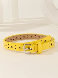 Macro detail of yellow leather belt featuring star-shaped cutouts and silver pin buckle