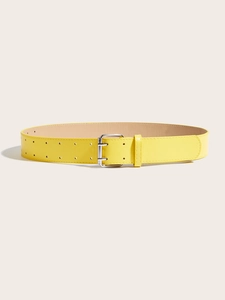 Close-up of bright yellow leather belt with silver double-pin buckle and dual adjustment holes