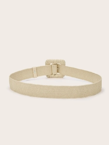Close-up of cream woven waist belt with a large fabric-wrapped square buckle