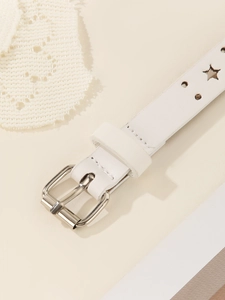 Detail of white thin star-perforated belt with silver buckle and lace decor