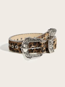 Detail of leopard print western belt with silver studs and engraved floral metal buckle