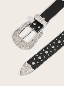 Detailed close-up of a black Western leather belt with rhinestones and metal studs