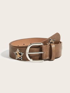 Detail of brown leather belt featuring leopard star patches and silver metal rivets