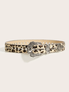 Detail of leopard print belt with vintage silver buckle and star shaped metal eyelets
