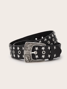 Detail of black leather belt with silver star studs and vintage engraved metal buckle